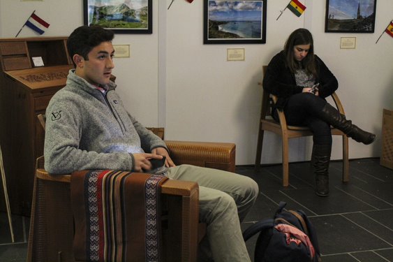 Students trying out Artesanos Don Bosco Furniture at the Loyola Notre Dame Library