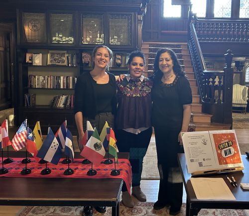 three professors post for a picture