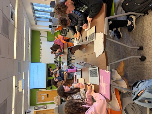 students on computers in the LLC