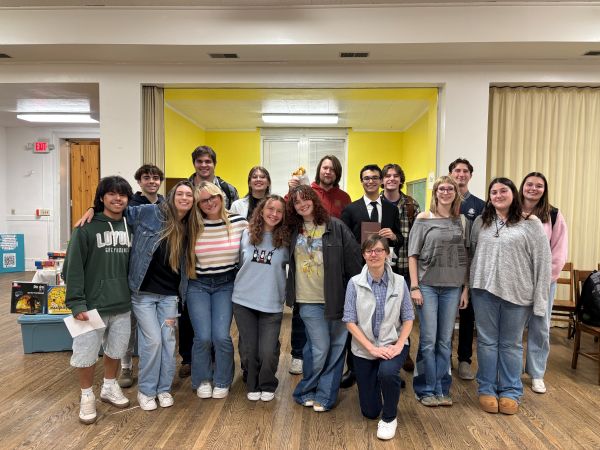 students posing in a church rec room