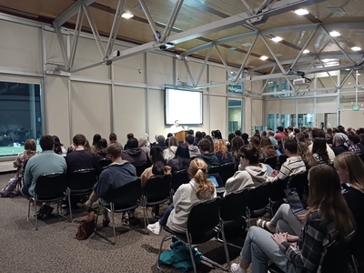 Back angle of audience at talk by Dr. Marwan Darweish