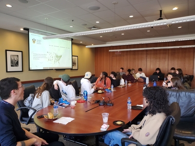 Dr. Loadenthal presenting to 22 students at Careers in Peace and Justice lunch talk