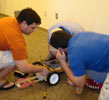 Students checking a robot