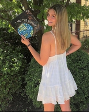 Liz Kosik showing off her decorated graduation mortarboard