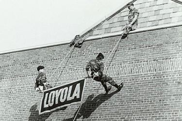 Loyola ROTC members rappel down building