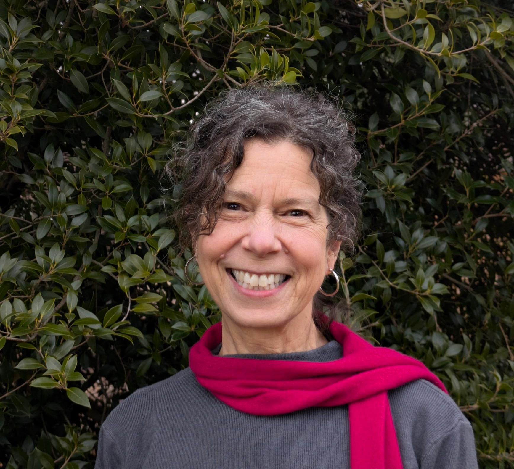 photo of Ann Rentschler with a pink scarf