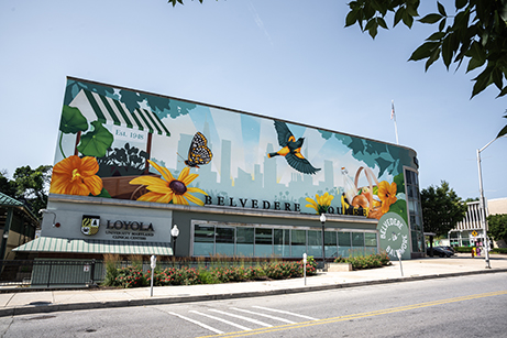 A streetview of the Loyola Clinical Centers featuring a large mural of birds and flowers.