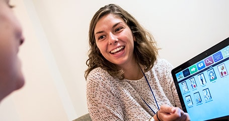 Speech graduate student works with patient