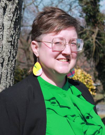 Irene Bal wearing a green shirt