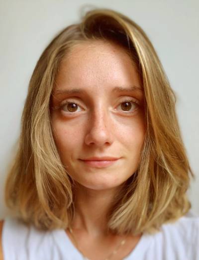 Portrait of Isa Gold (Goldstein) wearing a white shirt