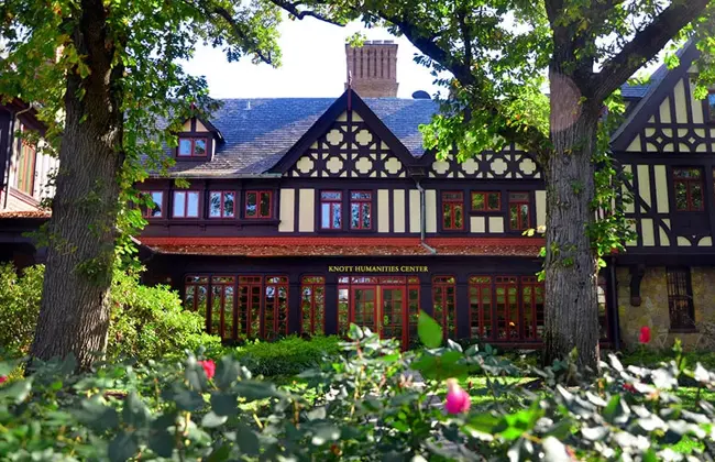 Humanities building with roses in the foreground