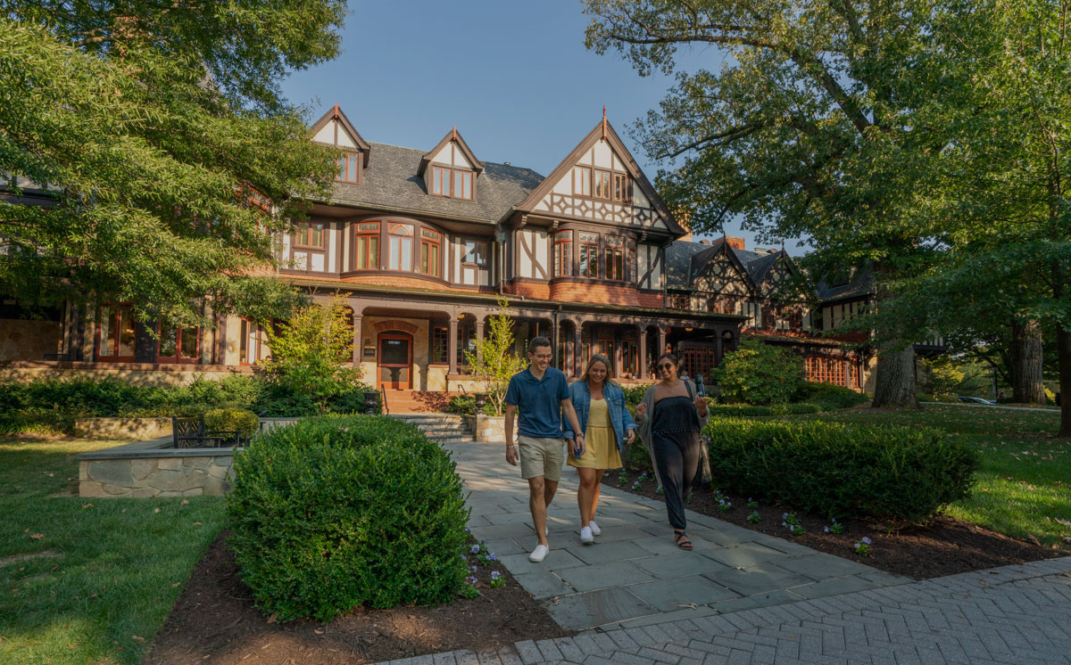 Students walking in front of the Humanities Building - Press enter to play
