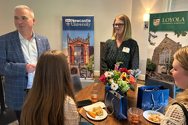 President Terry Sawyer and wife Courtney chat with students during the Loyola-Newcastle 30th Anniversary celebration event