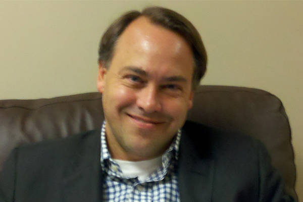 William "Billy" Edwards, ’85, smiles for an image