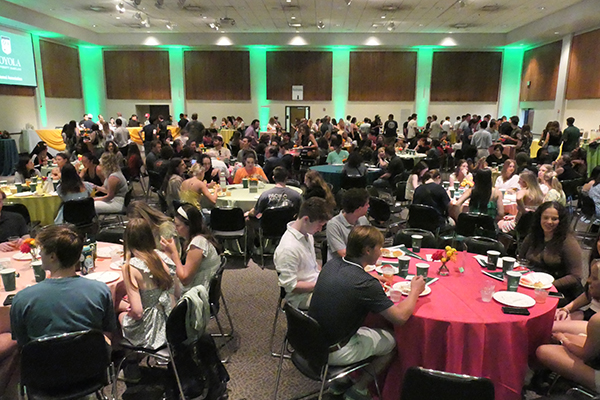 A wide-angel view of McGuire Hall shows a healthy turnout for the 2025 Senior Barbecue