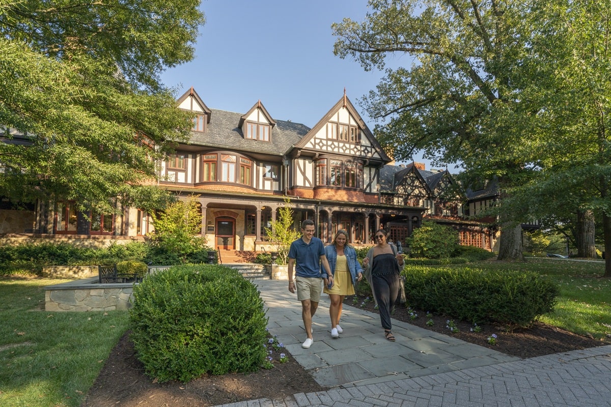 Loyola students walking in front of the Humanities building