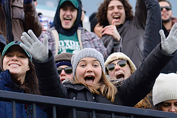Fans cheer on the Greyhounds in the student section at Ridley Athletic Complex