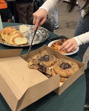 Students cutting different kinds of bread