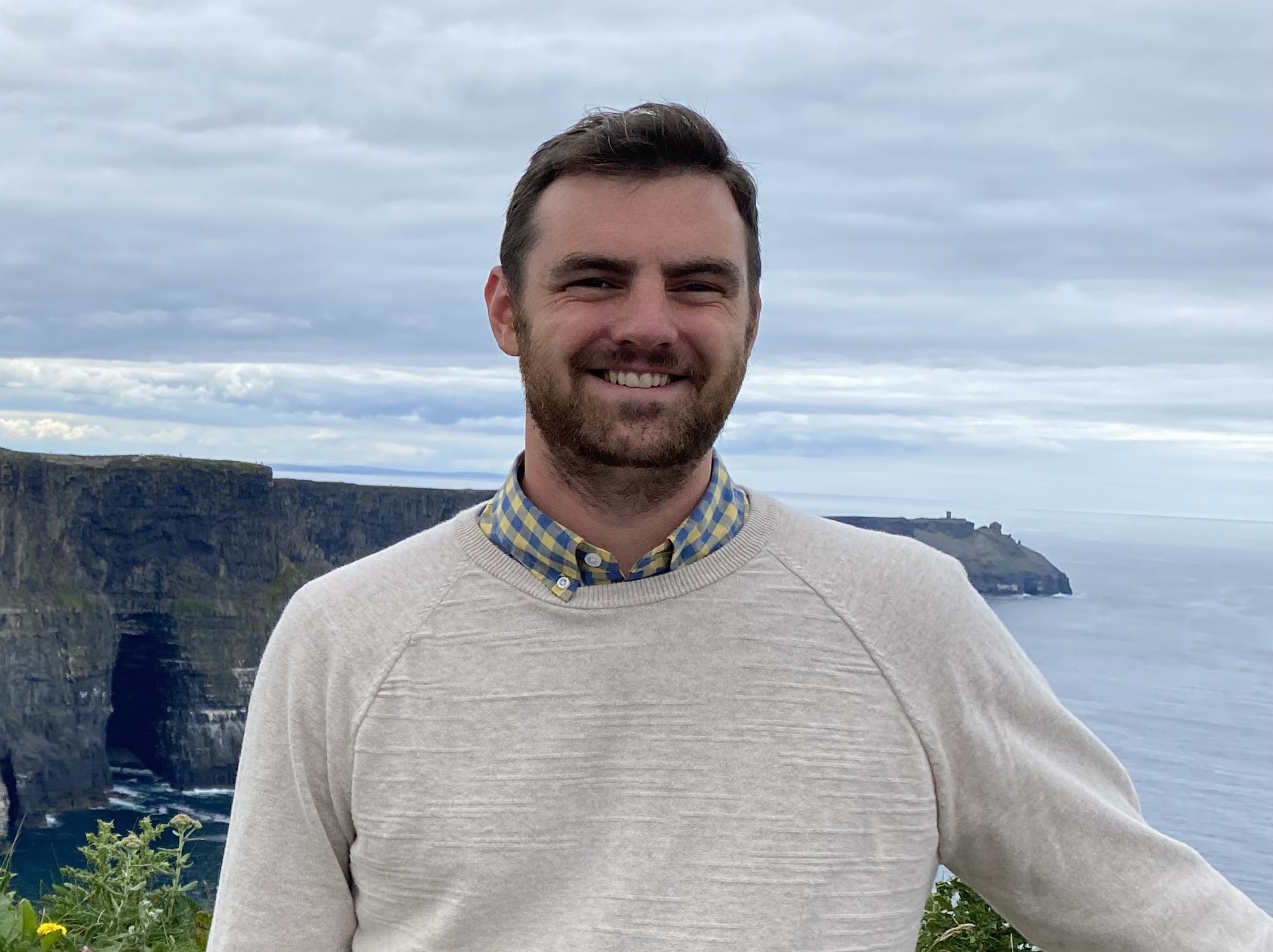 Man in front of the cliffs of Moher