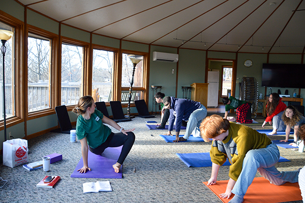 Students doing yoga during interfaith retreat 2026