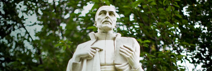 Marble statue of St. Ignatius on the Loyola University Maryland academic quad