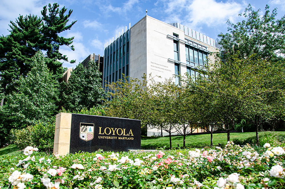 exterior of Donnelly hall and Loyola University Maryland sign