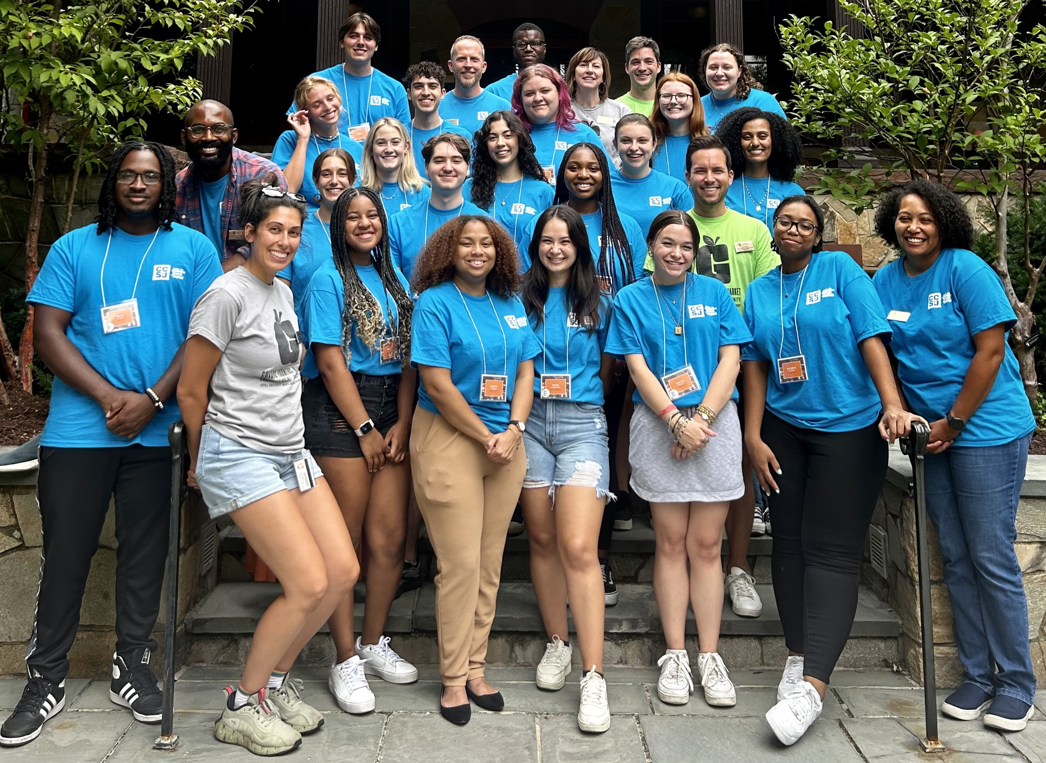 Photo of 2023-2024 CCSJ Student and Professional Staff in Front of Humanities Porch