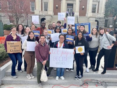 A group of students with signs