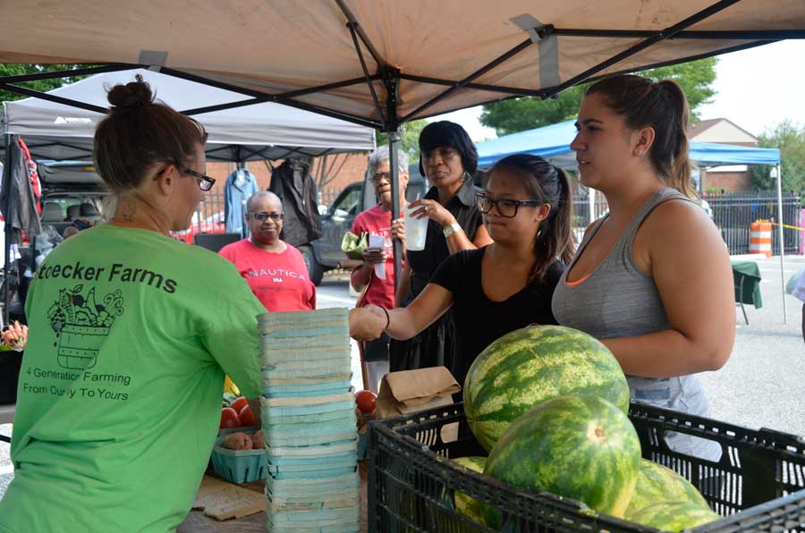 students at farmers market