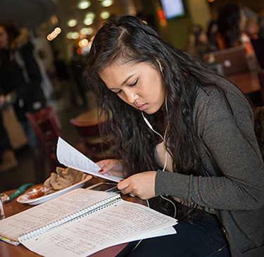 Student looking at notes