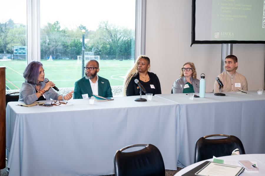 Individuals Speaking on a Panel