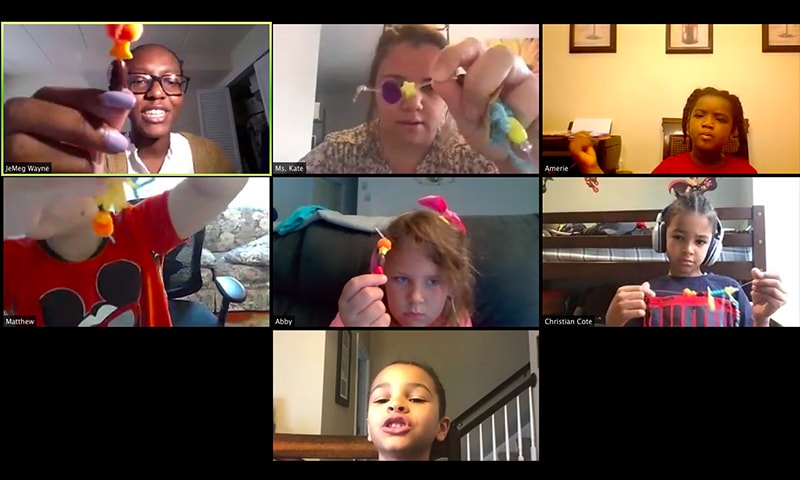 Screenshot of children working on arts and crafts projects on a Zoom conference