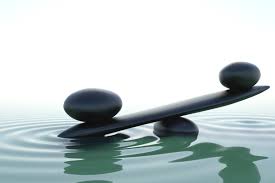 stones balanced and reflecting pool