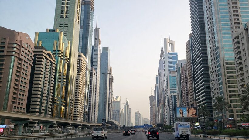 The financial district in Dubai, filled with skyscrapers and long roads.
