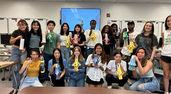 Group of students showing the lanterns they made at a Chinese club event