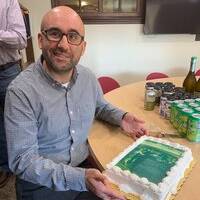 picture of Andrew Ross with cake 