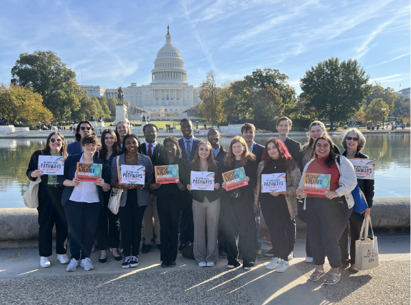 People holding signs in front of the US Capitol building