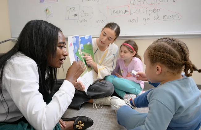Loyola Clinical Center employees working with students