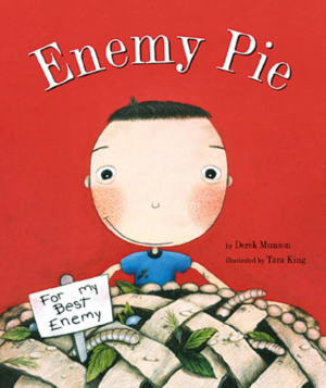 Cover of Enemy Pie, an illustration of a boy with a pie full of worms and leaves