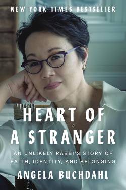 Cover of Heart of a Stranger, a photograph of the author with the book title in white text