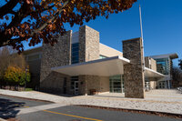 Carpool lane in front of the glass and stone FAC building