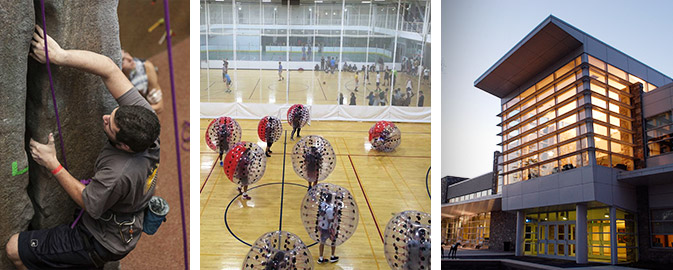 Student climbing rock wall, students in inflatable balls, external shot of FAC