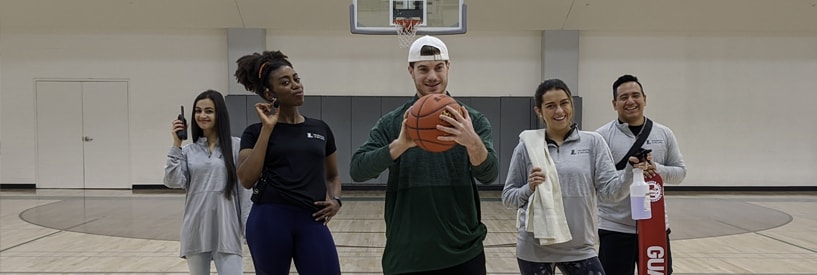 FAC employees from different areas together on the basketball court