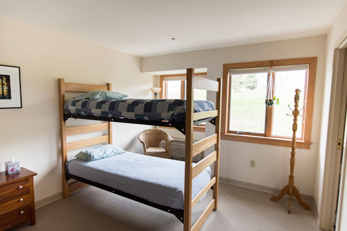 View of goldenrod room with bunk bed