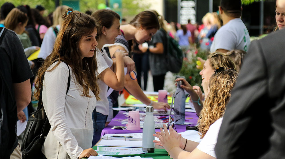 students at the activities fair - Press enter to play