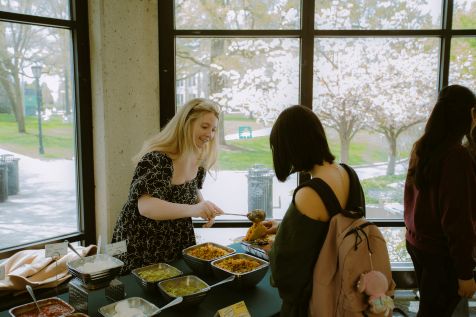Sydney Quantock helping student at Affirmative Consent taco bar