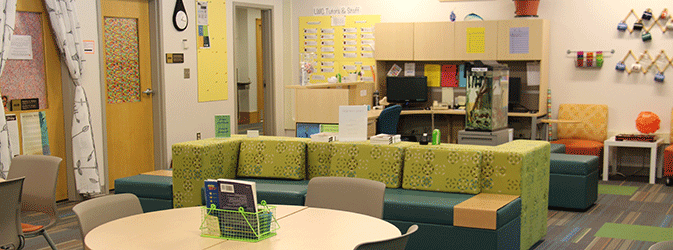 View of Writing Center space with tables and couches