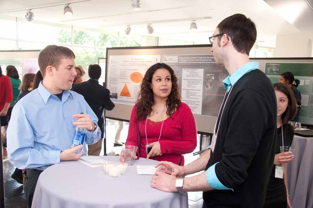 Group at table at poster session