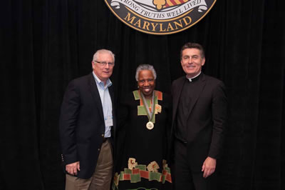 L. Mickey Fenzel, Linda Ellard Mouzon, and Father Linnane