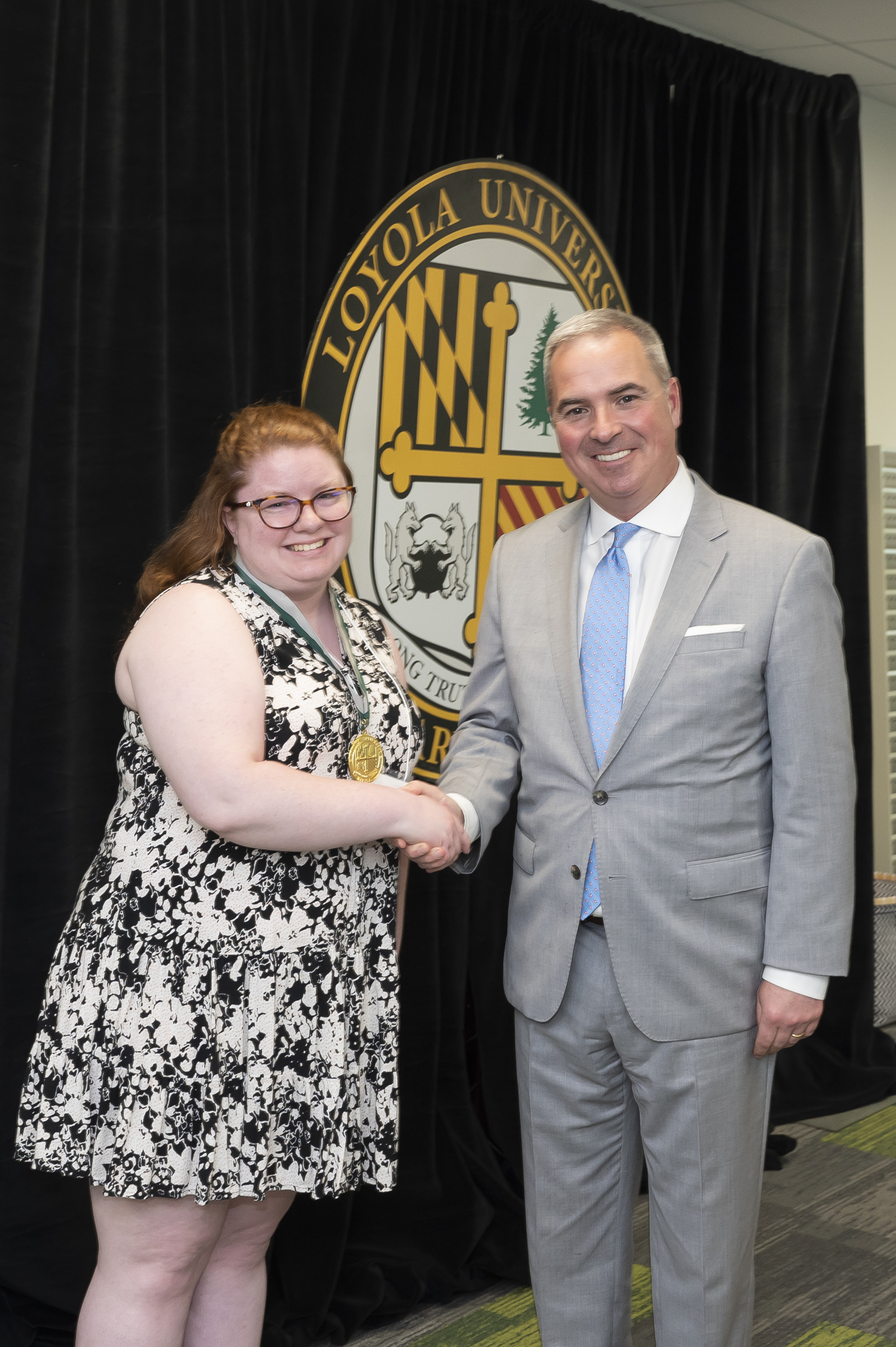 President Sawyer and awardee Emerging Scholars Celebration of Research, Loyola Univ. Maryland